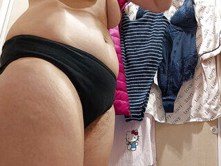 Naughty sexy milf tries on naked clothes. Latina hairy pussy tries on clothes in bed.