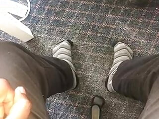 Young African feet out in socks in the office