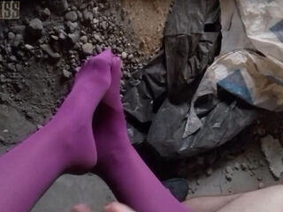 'POV video of NightMiss feet in purple pantyhose giving sloppy handjob'